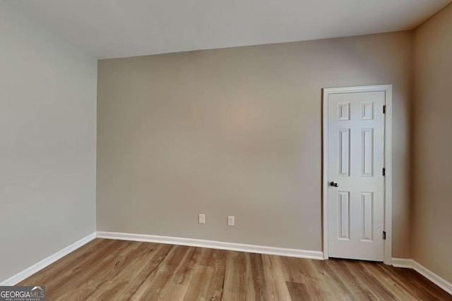 spare room with light wood-type flooring