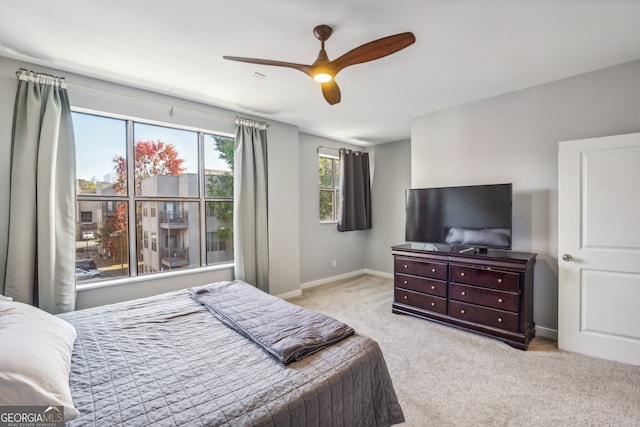 carpeted bedroom featuring ceiling fan