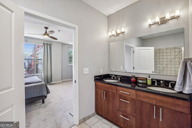 bathroom featuring ceiling fan, vanity, and tile patterned flooring