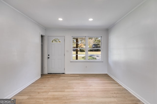 entryway featuring light hardwood / wood-style floors and crown molding