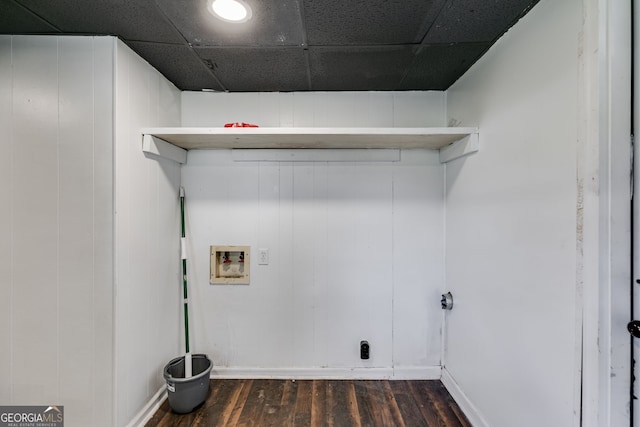 clothes washing area featuring hookup for a washing machine, wooden walls, and dark hardwood / wood-style floors