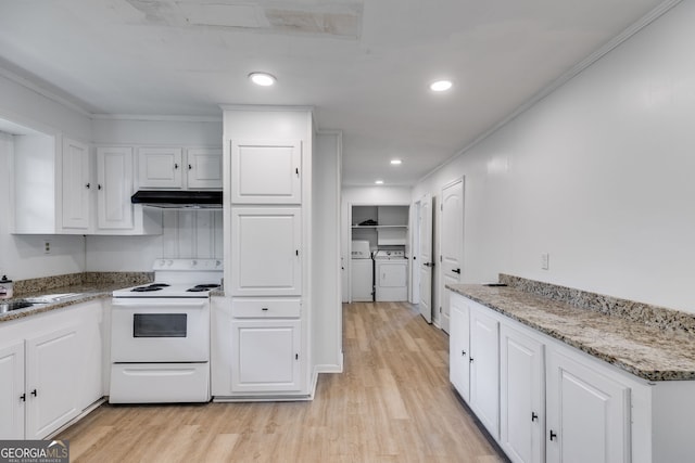 kitchen with white cabinets, washer and dryer, light hardwood / wood-style floors, and white electric stove