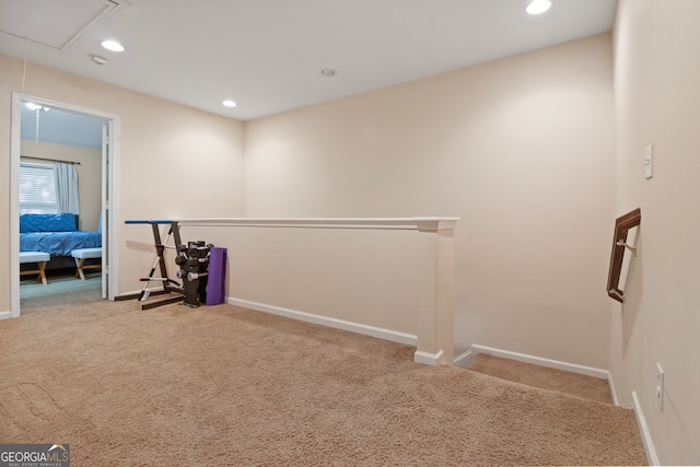 hallway with light carpet