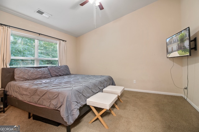 carpeted bedroom with lofted ceiling and ceiling fan