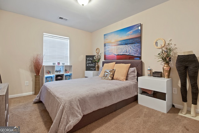 bedroom with light carpet