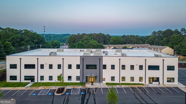 view of outdoor building at dusk