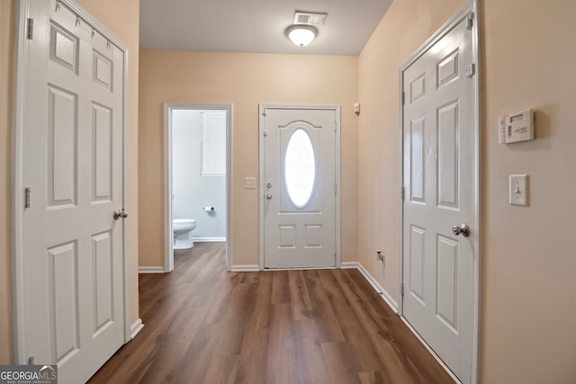 entrance foyer featuring dark hardwood / wood-style floors