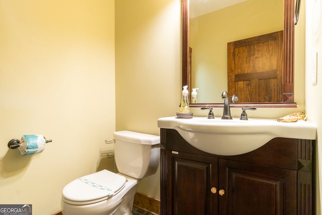 bathroom featuring vanity and toilet