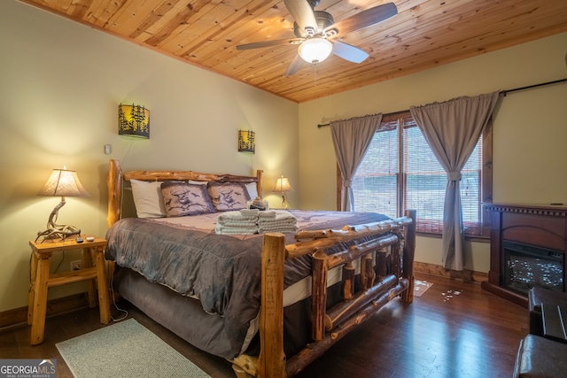 bedroom featuring wood ceiling, ceiling fan, and dark hardwood / wood-style flooring