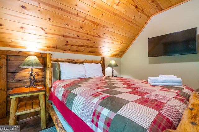 bedroom with lofted ceiling and wooden ceiling