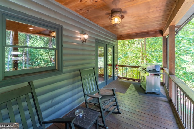 deck featuring french doors and area for grilling