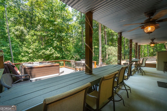 wooden terrace featuring ceiling fan