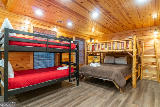 bedroom with hardwood / wood-style floors, wooden ceiling, and wooden walls