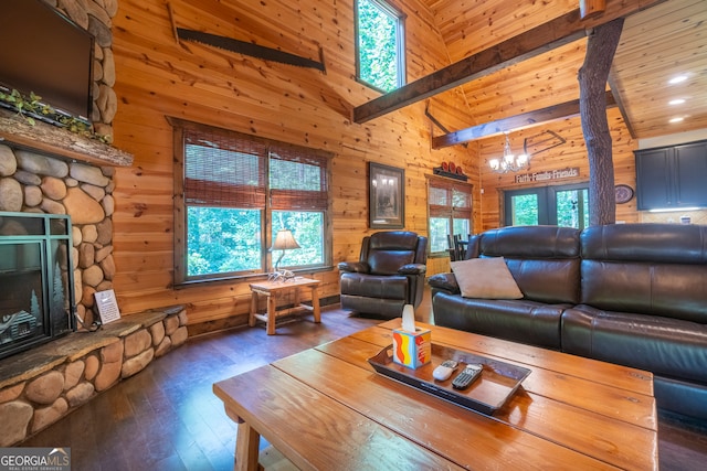 living room featuring dark wood-type flooring, high vaulted ceiling, and wood walls