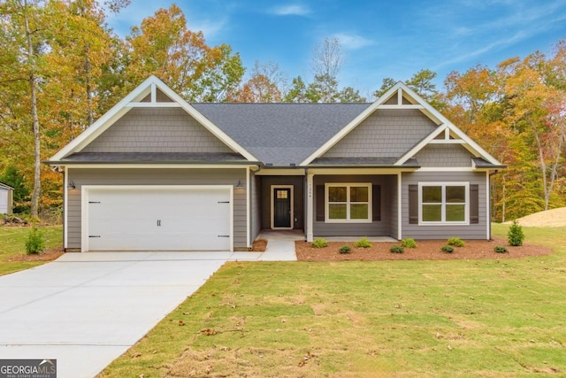 craftsman-style home featuring a garage and a front lawn