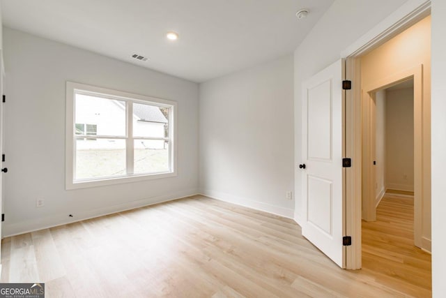 unfurnished room featuring light hardwood / wood-style flooring