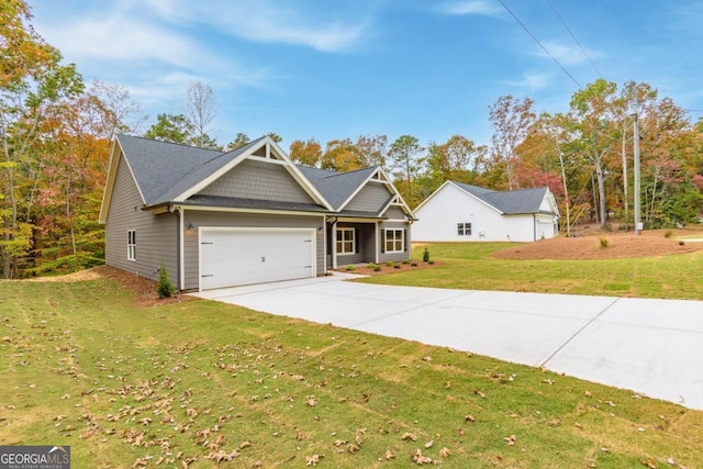 view of front facade featuring a front lawn and a garage