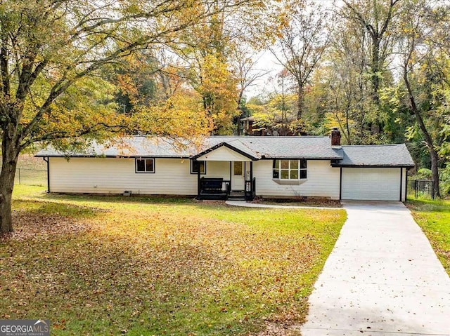 ranch-style house with a front yard and a garage