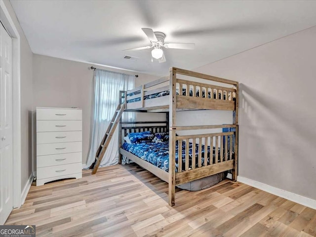 bedroom featuring ceiling fan and light hardwood / wood-style flooring