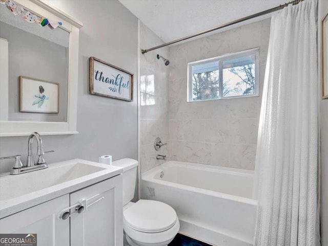 full bathroom featuring vanity, shower / tub combo with curtain, and toilet