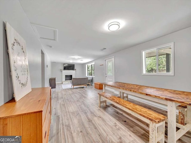 unfurnished dining area with light wood-type flooring