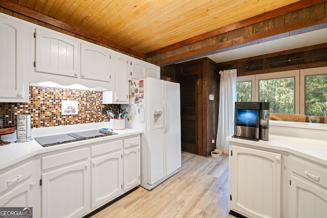 kitchen with white cabinetry, white refrigerator with ice dispenser, and light hardwood / wood-style floors