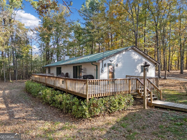 rear view of property with a deck