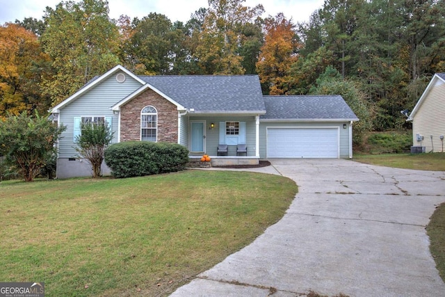 ranch-style house featuring central air condition unit, a front yard, and a garage