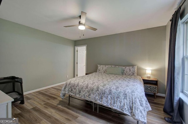 bedroom featuring ceiling fan and wood-type flooring