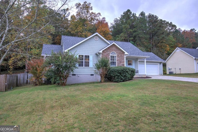 view of front of home with a front lawn and a garage