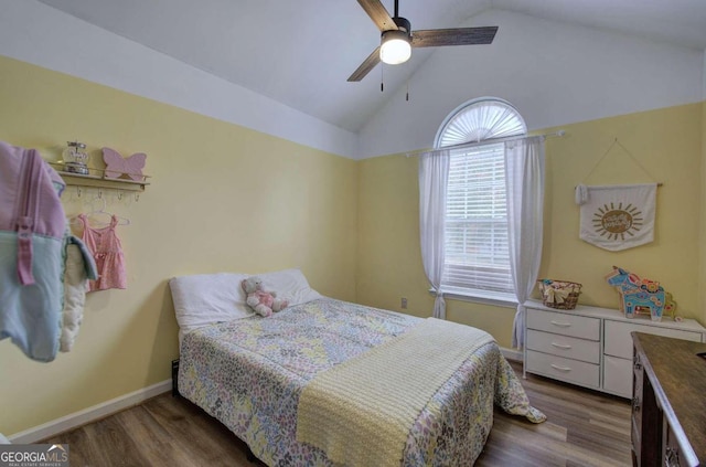 bedroom featuring ceiling fan, vaulted ceiling, and dark hardwood / wood-style flooring