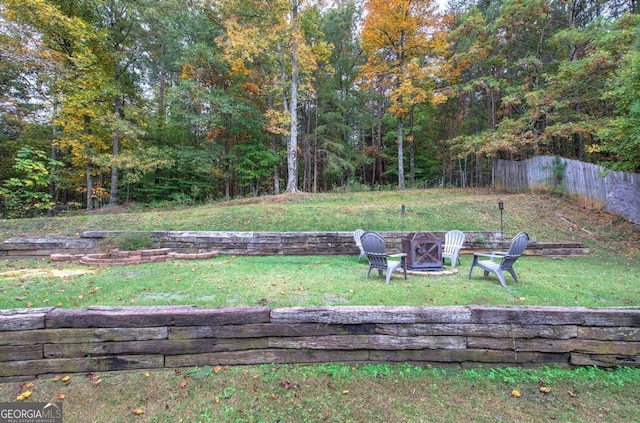 view of yard with a fire pit