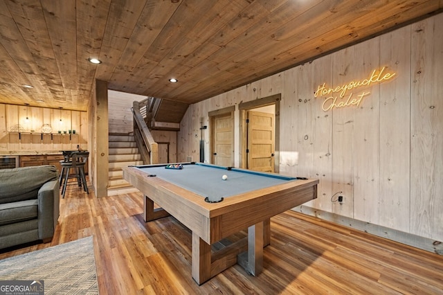 rec room with wood walls, light hardwood / wood-style flooring, pool table, and wooden ceiling