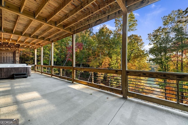 view of patio / terrace with a hot tub