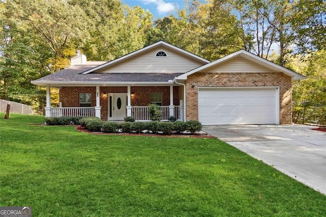 view of front of house with covered porch, a front yard, and a garage