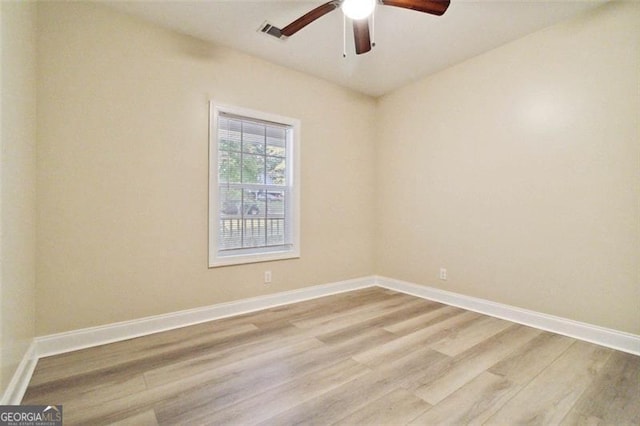 unfurnished room with light hardwood / wood-style flooring and ceiling fan