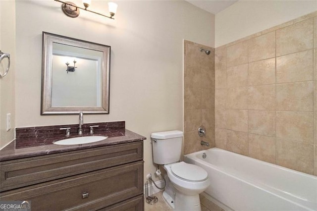 full bathroom featuring vanity, tiled shower / bath combo, toilet, and tile patterned floors