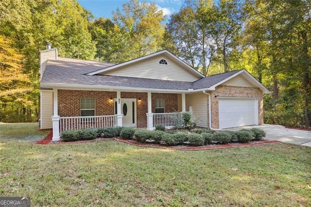 view of front of house featuring a front yard, a porch, and a garage