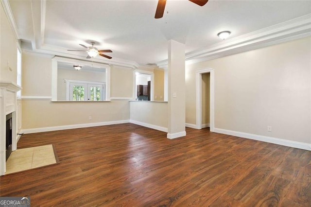 unfurnished living room featuring crown molding, dark hardwood / wood-style floors, and ceiling fan