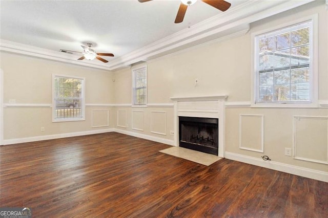 unfurnished living room with crown molding, dark hardwood / wood-style flooring, and ceiling fan