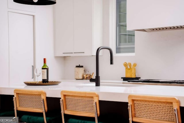 kitchen featuring white cabinets