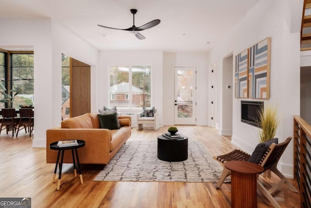 sitting room featuring ceiling fan and wood-type flooring