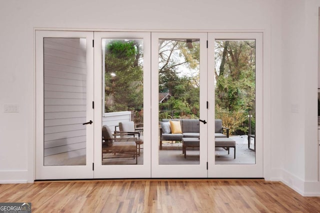 1281 Avalon Pl NE, Atlanta, GA 30306 - entryway featuring french doors, wood finished floors, and baseboards