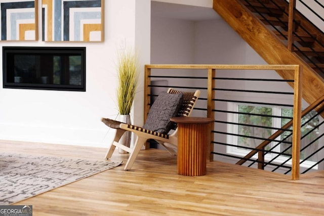 sitting room featuring hardwood / wood-style floors