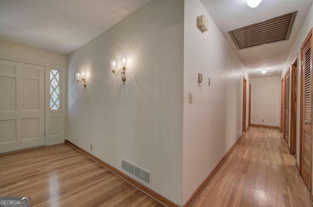 entrance foyer featuring light wood-type flooring, baseboards, and visible vents