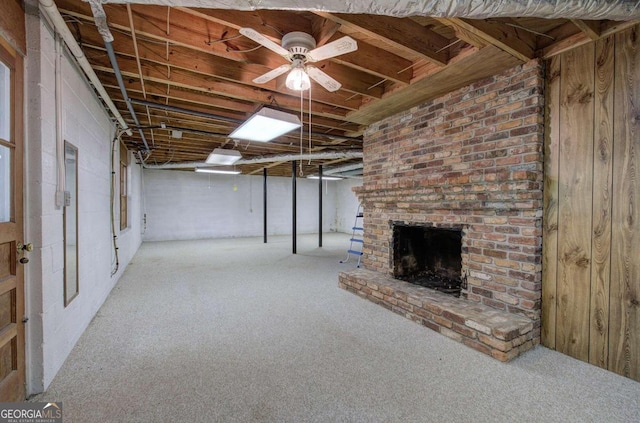 unfinished below grade area featuring carpet floors and a brick fireplace