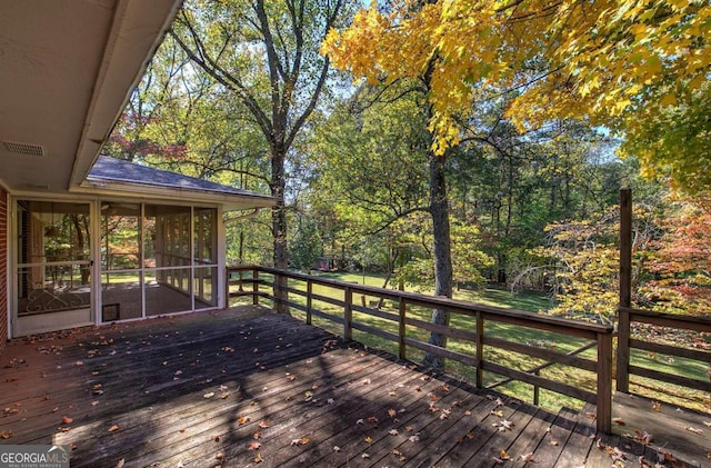 wooden terrace with a sunroom