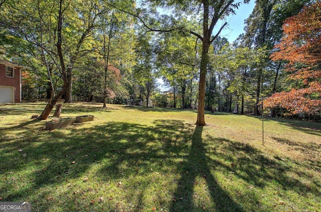 view of yard with a garage