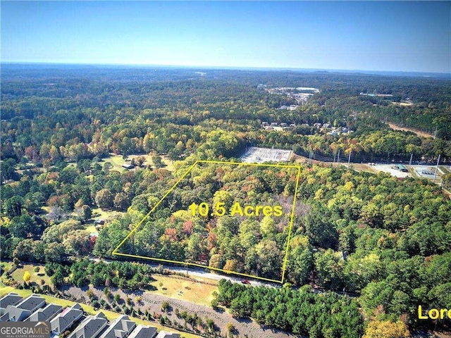 bird's eye view featuring a forest view