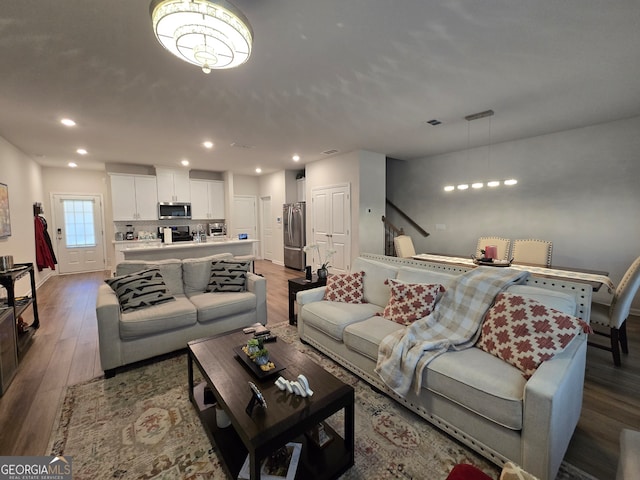 living room featuring dark hardwood / wood-style flooring